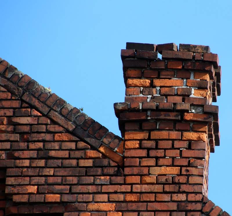 Signs Your Greenbelt Home Needs a Chimney Inspection Damaged chimney on an Greenbelt home showing cracks and missing mortar